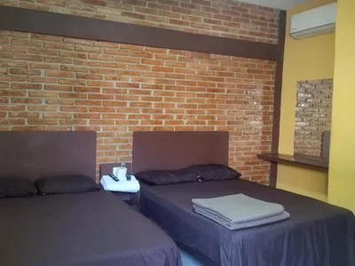 Recámara de Casa Xanath con dos camas