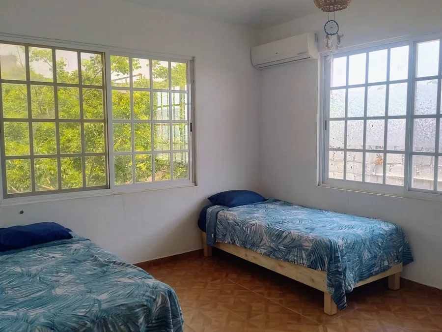 Recámara de Casa Ceci con dos camas individuales